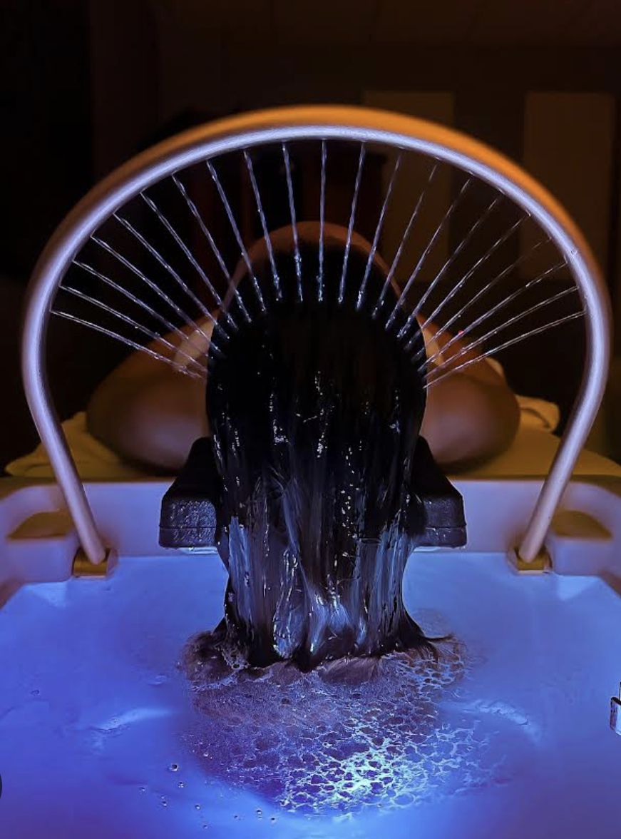 A calming head spa rinse with flowing water